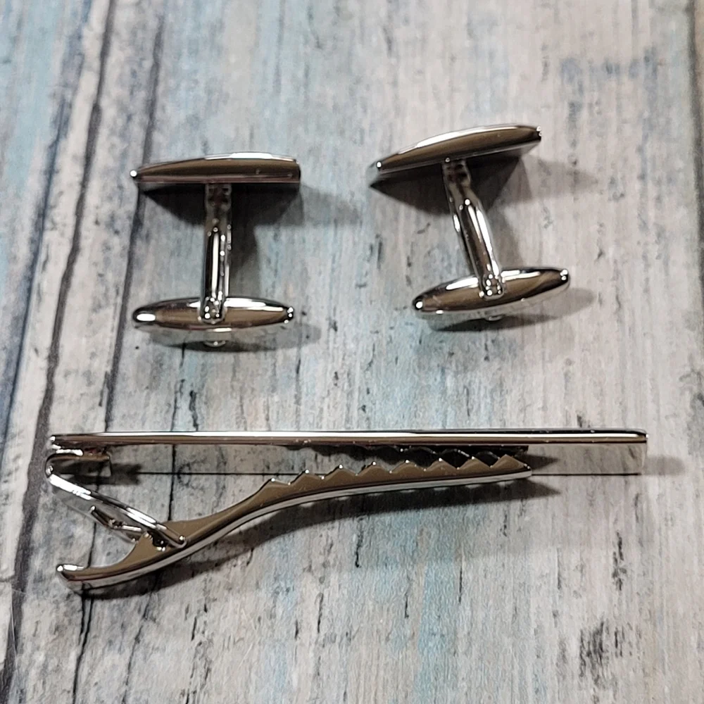Cuff Links and Tie clip.
